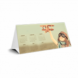 Calendário de Mesa - Simples Cartão 250g/m² Aberto: 20x29 cm - Fechado: 10x20 cm 4x0 Verniz Total Brilho Frente Corte e vinco 